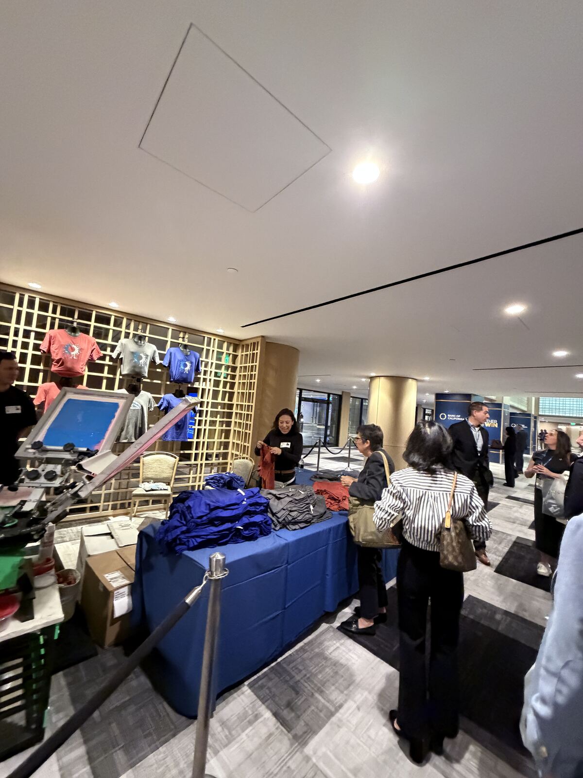 Overhead angle of an event booth showing staffing, product displays, and sample materials